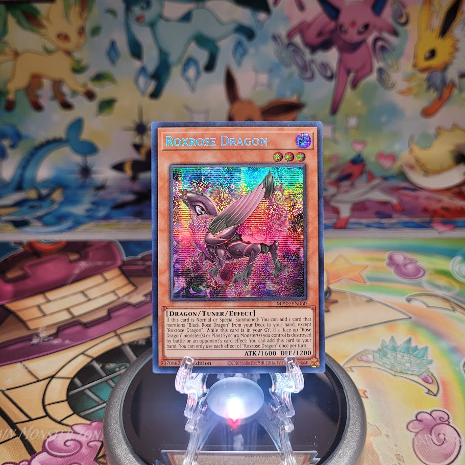 A Prismatic Secret Rare "Roxrose Dragon" card from the Yugioh 2022 Tin of the Pharaoh's Gods set (MP22).