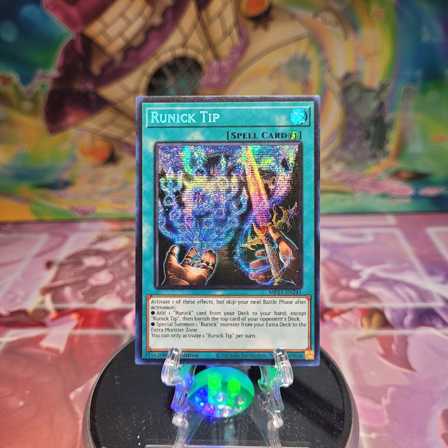 A Prismatic Secret Rare "Runick Tip" card from the Yugioh Set: 25th Anniversary Tin: Dueling Heroes Mega-Tin Mega Pack. 