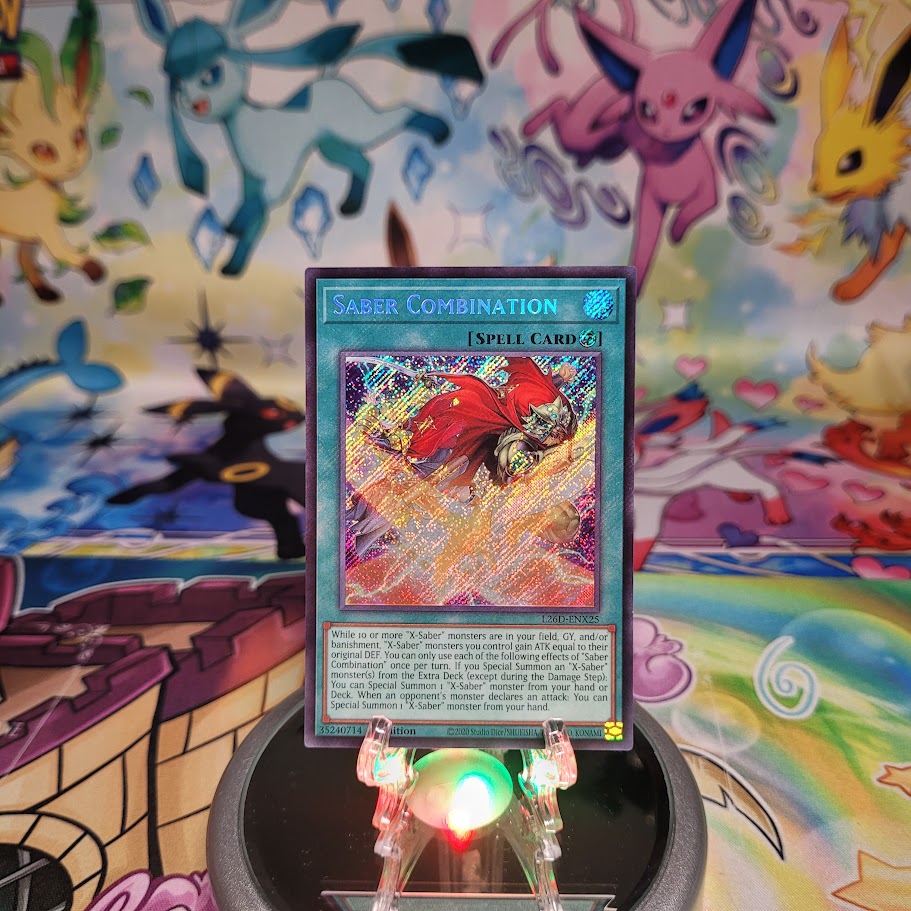 A Secret Rare "Saber Combination" card from the Yugioh Legendary Modern Decks (L26D).