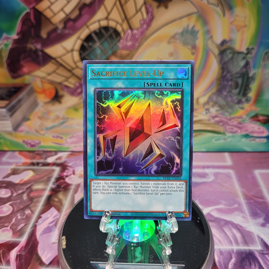 An Ultra Rare "Sacrifice Level-Up" card from the Yugioh Set: Battles of Legend: Terminal Revenge.