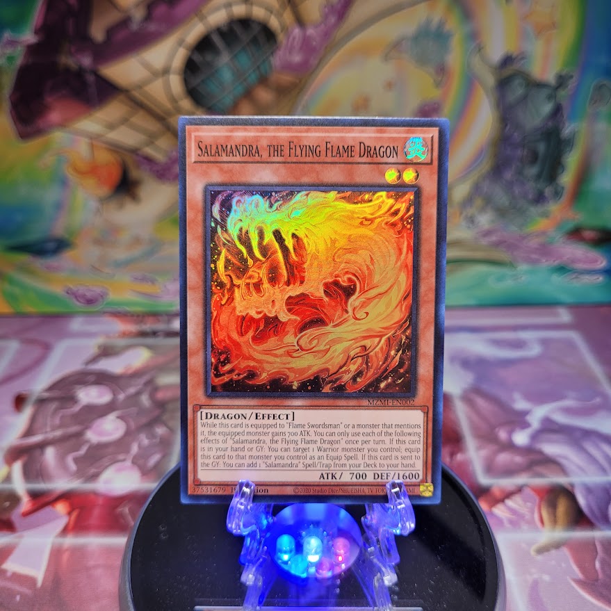 A Super Rare "Salamandra, the Flying Flame Dragon" card from the Yugioh Set: Maze of Millennia.