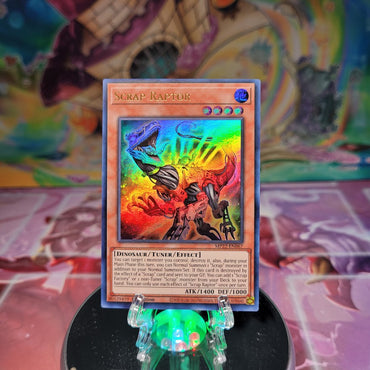 An Ultra Rare "Scrap Raptor" card from the Yugioh 2022 Tin of the Pharaoh's Gods Set (MP22).