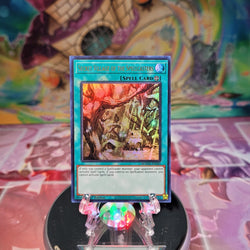 An Ultra Rare "Secret Village of the Spellcasters" card from the Yugioh Set: Magnificent Mavens.