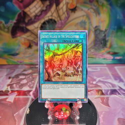 A Super Rare "Secret Village of the Spellcasters" card from the Yugioh OTS Tournament Pack 8.