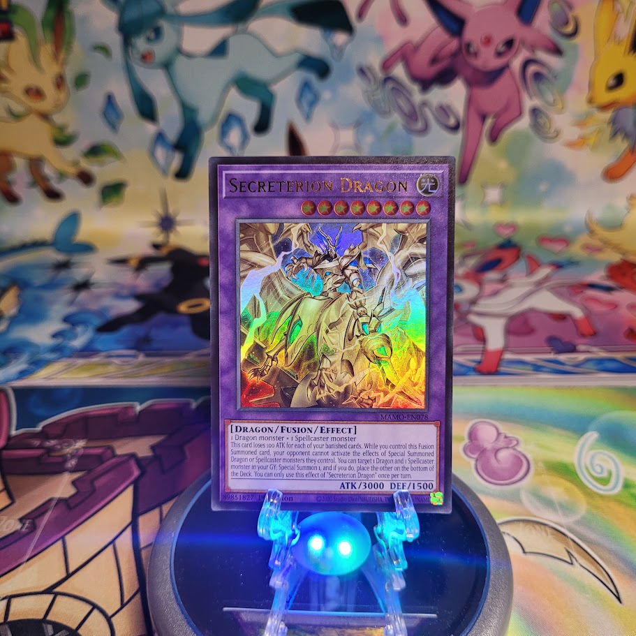 An Ultra Rare "Secreterion Dragon" card from the Yugioh Set: Magnificent Monsters (MAMO).