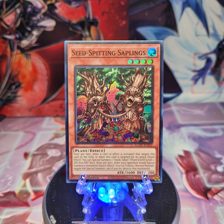 A Super Rare "Seed-Spitting Saplings" card from the Yugioh Set: Age of Overlord.