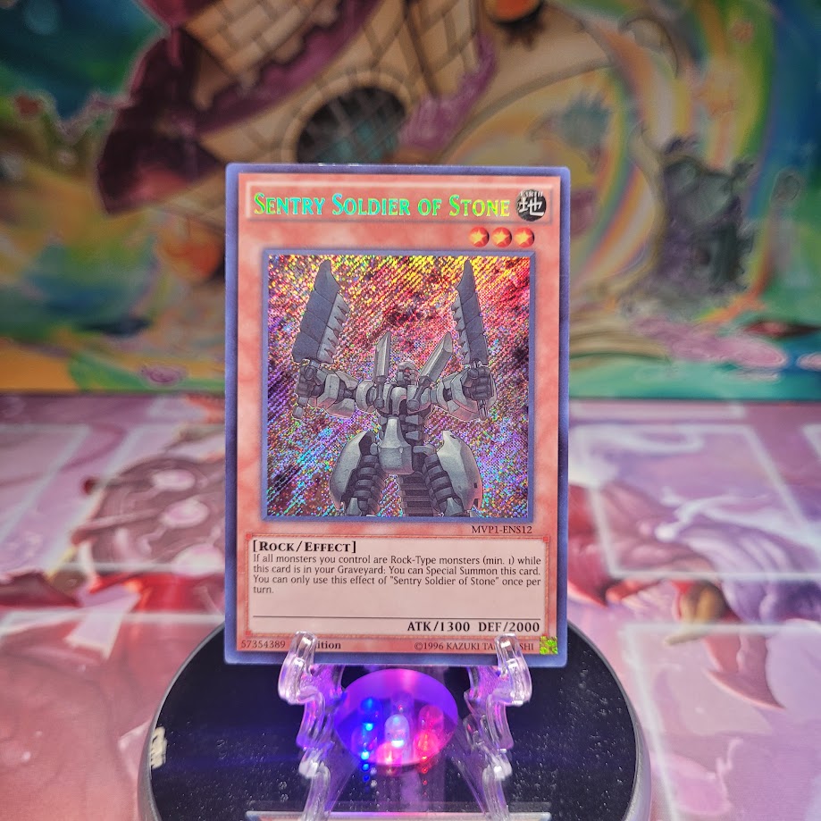 A Secret Rare "Sentry Soldier of Stone" card from the Yugioh Set: The Dark Side of Dimensions: Secret Edition