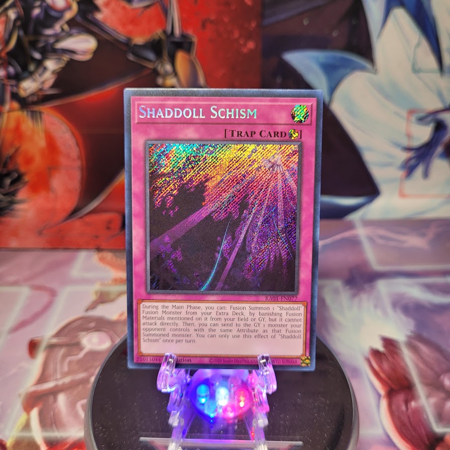 A Secret Rare "Shaddoll Schism" card from the Yugioh Set: Rarity Collection 1 (RA01).