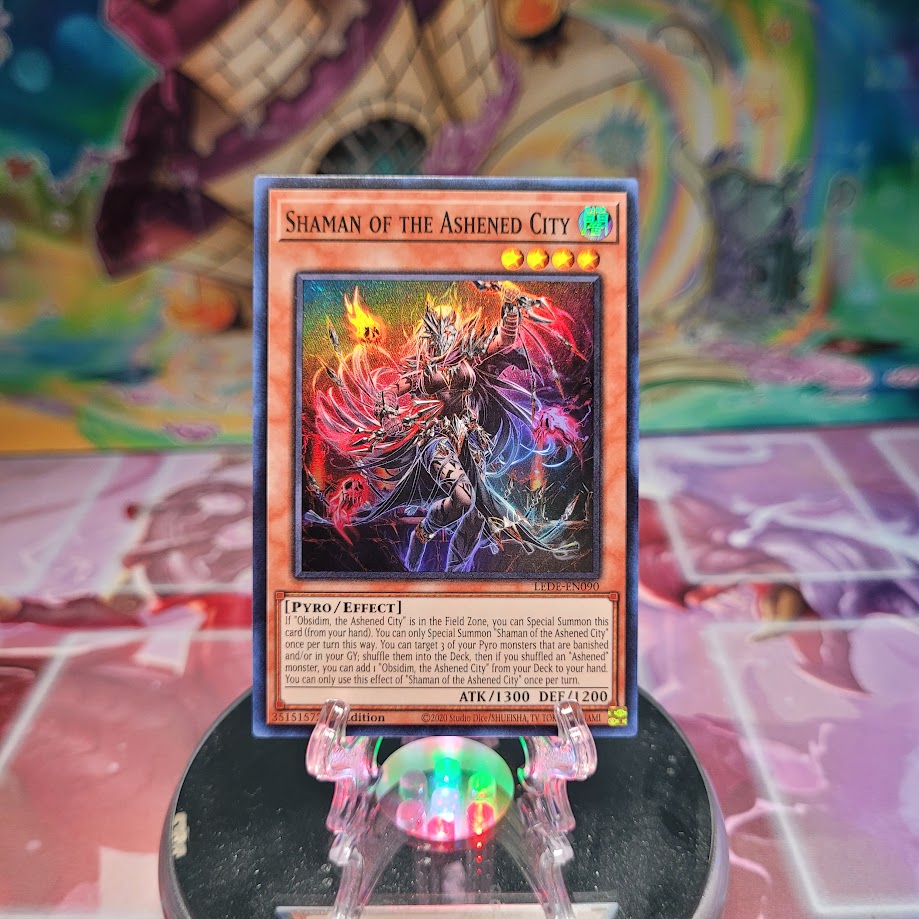 A Super Rare "Shaman of the Ashened City" card from the Yugioh Set: Legacy of Destruction.