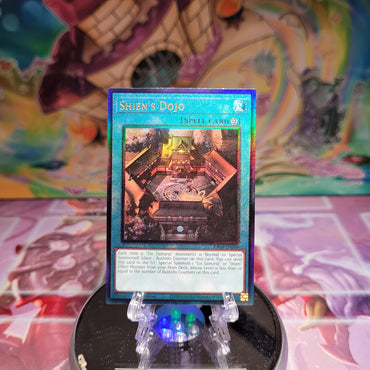 A Prismatic Ultimate Rare "Shien's Dojo" card from the Yugioh Set: Quarter Century Stampede (RA04).