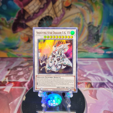 An Ultra Rare "Shooting Star Dragon T.G. Ex" card from the Yugioh Set: Ghosts From the Past.