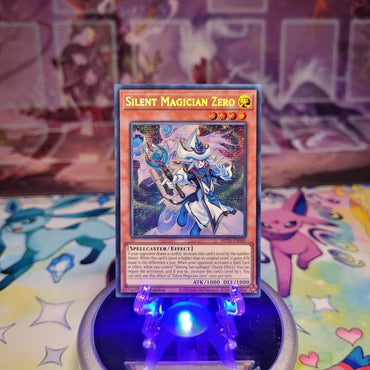 A Prismatic Secret Rare "Silent Magician Zero" card from the Yugioh 2025 Mega-Tin Mega Pack set (MP25).