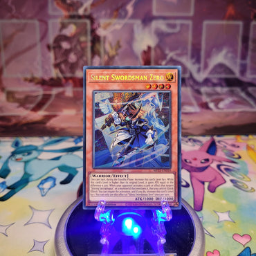 A Prismatic Secret Rare "Silent Swordsman Zero" card from the Yugioh 2025 Mega-Tin Mega Pack set (MP25).