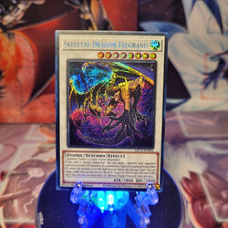 A Prismatic Secret Rare "Skeletal Dragon Felgrand" card from the Yugioh 25th Anniversary Tin: Dueling Heroes set.