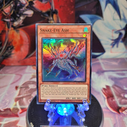 A Super Rare "Snake-Eye Ash" card from the Yugioh Set: Age of Overlord.