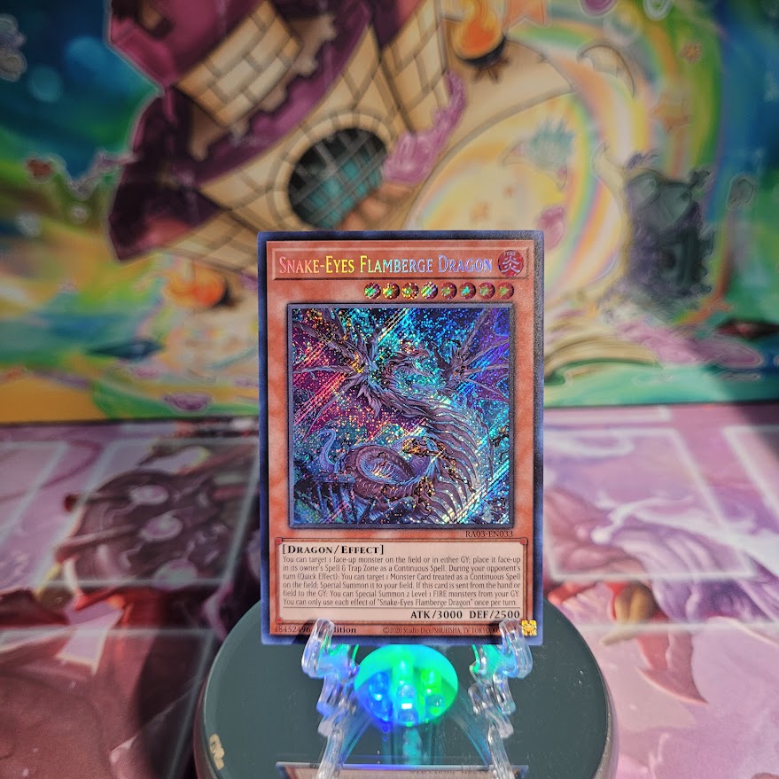 A Secret Rare "Snake-Eyes Flamberge Dragon" card from the Yugioh Set: Quarter Century Bonanza (RA03).