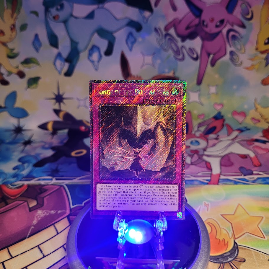 A Platinum Secret Rare "Songs of the Dominators" card from the Yugioh Set: Rarity Collection 5 (RA05).
