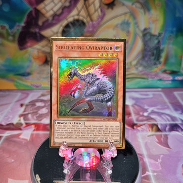  A Gold Rare "Souleating Oviraptor" card from the Yugioh Set: Maximum Gold: El Dorado.