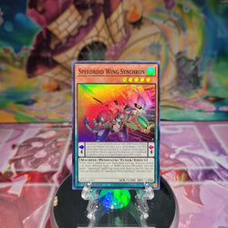 A Super Rare "Speedroid Wing Synchron" card from the Yugioh Set: Supreme Darkness (SUDA).
