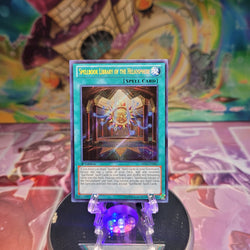 A Secret Rare "Spellbook Library of the Heliosphere" card from the Yugioh Set: Abyss Rising.