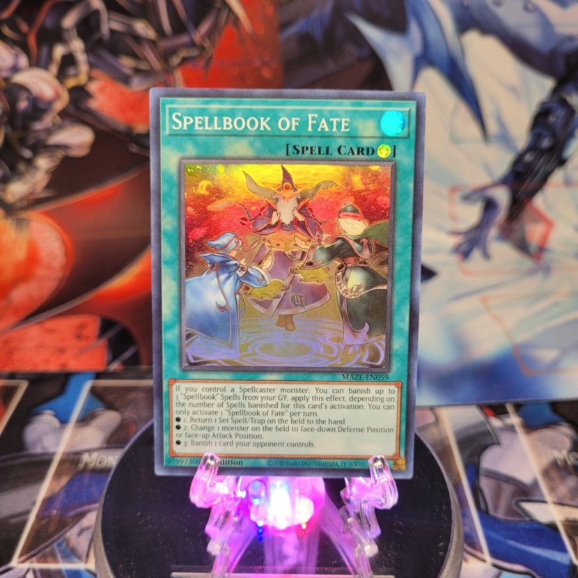 A Super Rare "Spellbook of Fate" card from the Yugioh Set: Maze of Memories.