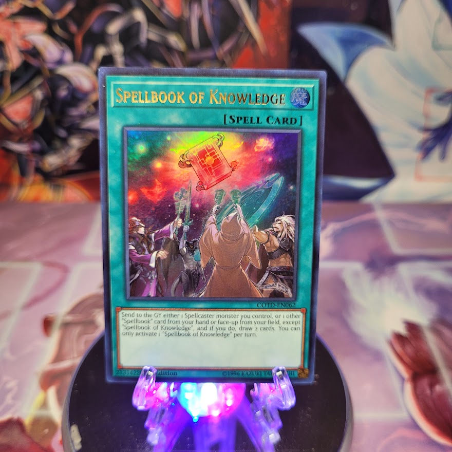 An Ultra Rare "Spellbook of Knowledge" card from the Yugioh Set: Code of the Duelist.