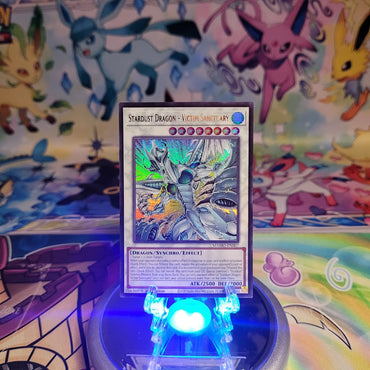 An Ultra Rare "Stardust Dragon - Victim Sanctuary" card from the Yugioh Set: Magnificent Monsters (MAMO).