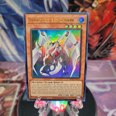 An Ultra Rare "Stardust Synchron" card from the Yugioh 2022 Tin of the Pharaoh's Gods Set (MP22).