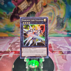 A Super Rare "Starliege Lord Galaxion" card from the Yugioh 2014 Mega-Tins.