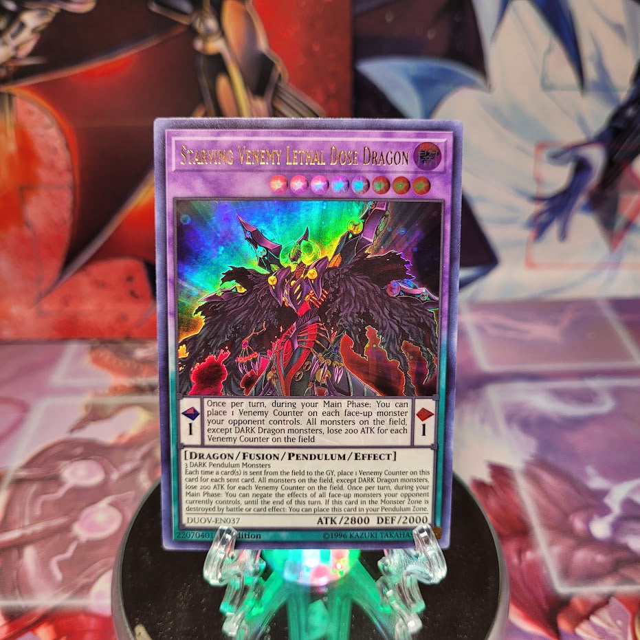 An Ultra Rare "Starving Venemy Lethal Dose Dragon" card from the Yugioh Set: Duel Overload (DUOV).