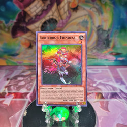 A Super Rare "Subterror Fiendess" card from the Yugioh Set: Maximum Crisis.