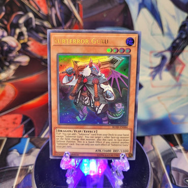 An Ultra Rare "Subterror Guru" card from the Yugioh Set: Battles of Legend: Hero's Revenge.