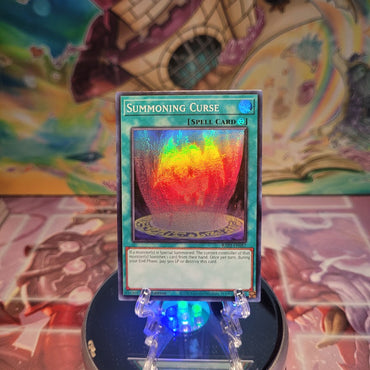 A Super Rare "Summoning Curse" card from the Yugioh Set: Quarter Century Bonanza (RA03).