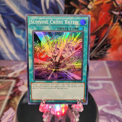 A Super Rare "Sunvine Cross Breed" card from the Yugioh 2022 Tin of the Pharaoh's Gods Set.