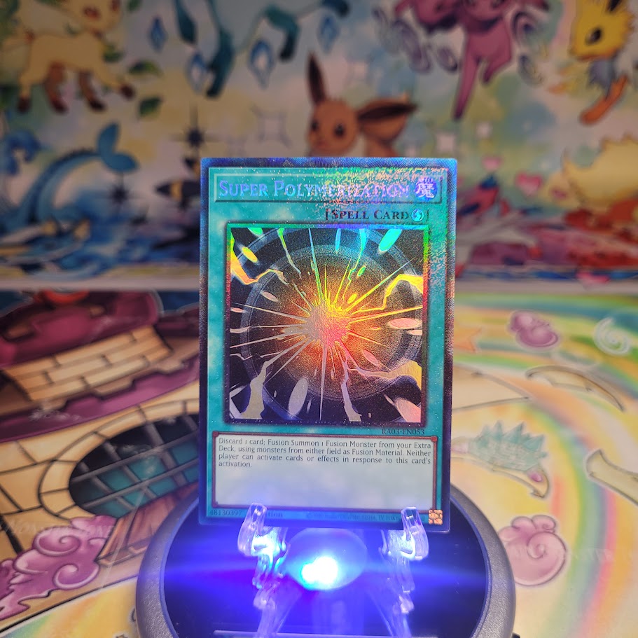 A Prismatic Collector's Rare "Super Polymerization" card from the Yugioh Set: Quarter Century Bonanza (RA03).