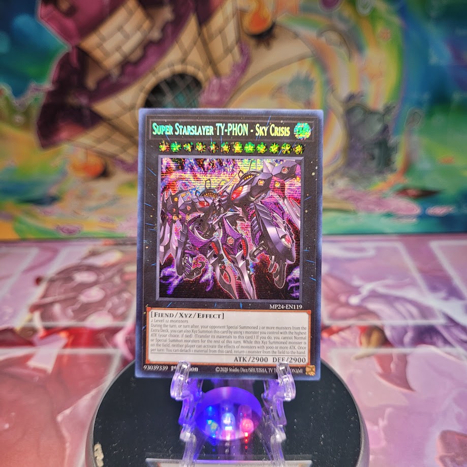 A Prismatic Secret Rare "Super Starslayer TY-Phon - Sky Crisis" card from the Yugioh 25th Anniversary: Dueling Mirrors Tin.