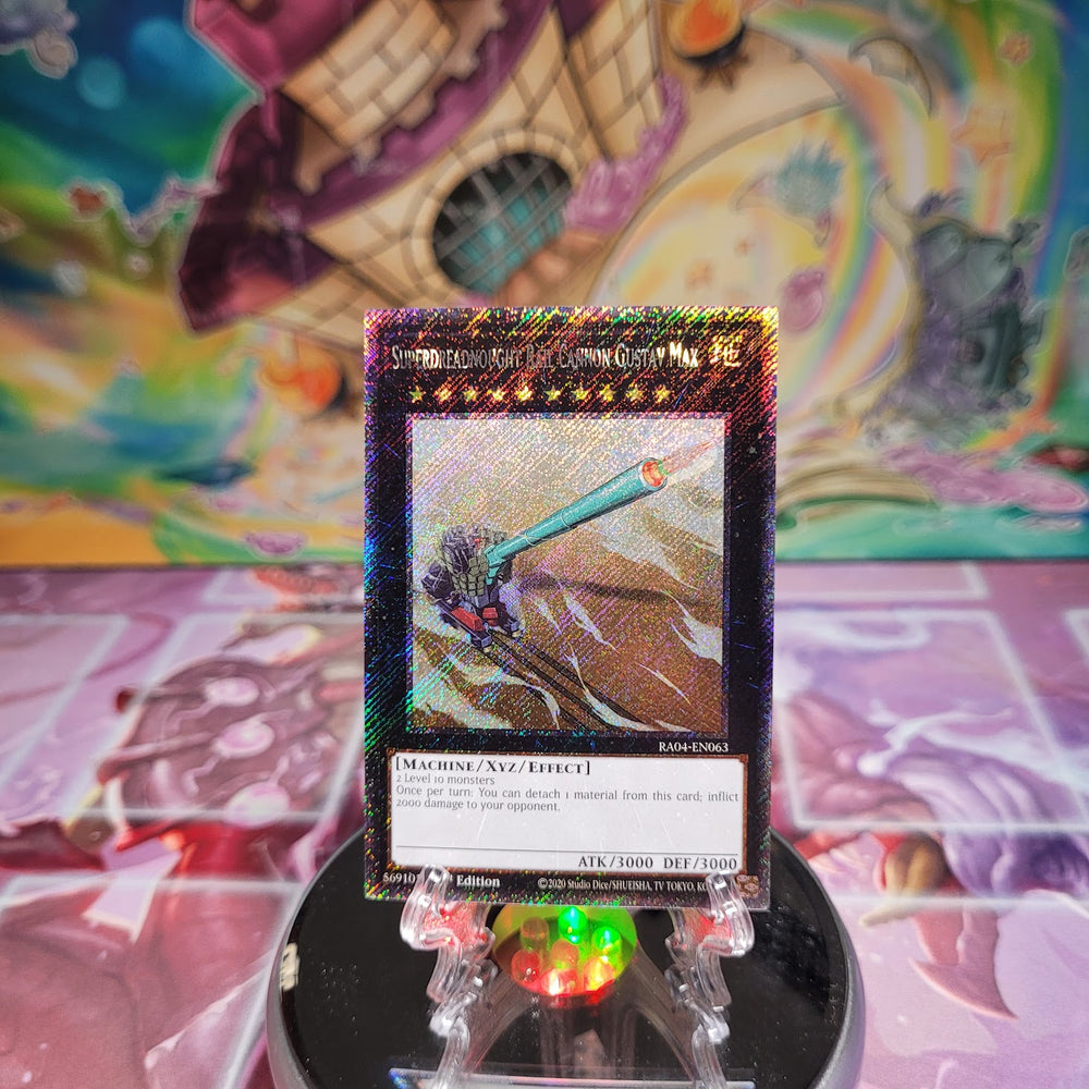 A Platinum Secret Rare "Superdreadnought Rail Cannon Gustav Max" card from the Yugioh Set: Quarter Century Stampede (RA04).