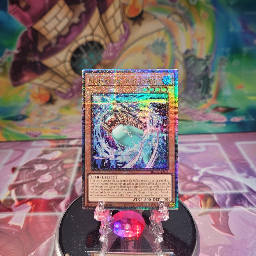 A Quarter Century Secret Rare "Surfacing Big Jaws" card from the Yugioh Set: Rage of the Abyss.