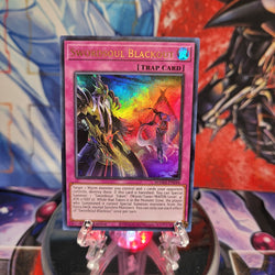 An Ultra Rare "Swordsoul Blackout" card from the Yugioh Set: Magnificent Mavens.