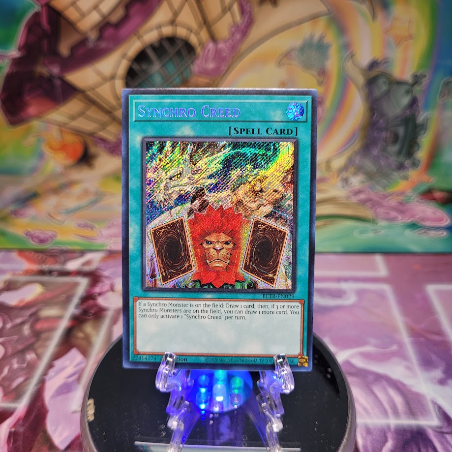 A Secret Rare "Synchro Creed" card from the Yugioh Set: Battles of Legend: Terminal Revenge.