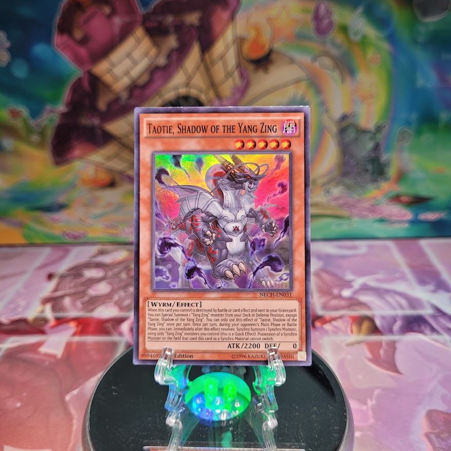 A Super Rare "Taotie, Shadow of the Yang Zing" card from the Yugioh Set: The New Challengers.