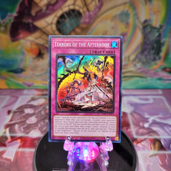 A Super Rare "Terrors of the Afterroot" card from the Yugioh Set: Phantom Nightmare.