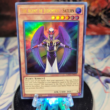  An Ultra Rare "The Agent of Judgment - Saturn" card from the Yugioh Set: Ghosts From the Past: The 2nd Haunting (GFP2).