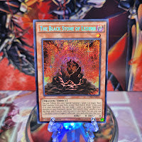 A Secret Rare "The Black Stone of Legend" card from the Yugioh Set: Clash of Rebellions (CORE).