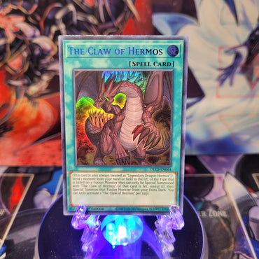 An Ultra Rare Blue "The Claw of Hermos" card from the Yugioh Set: Dragons of Legend: The Complete Series.