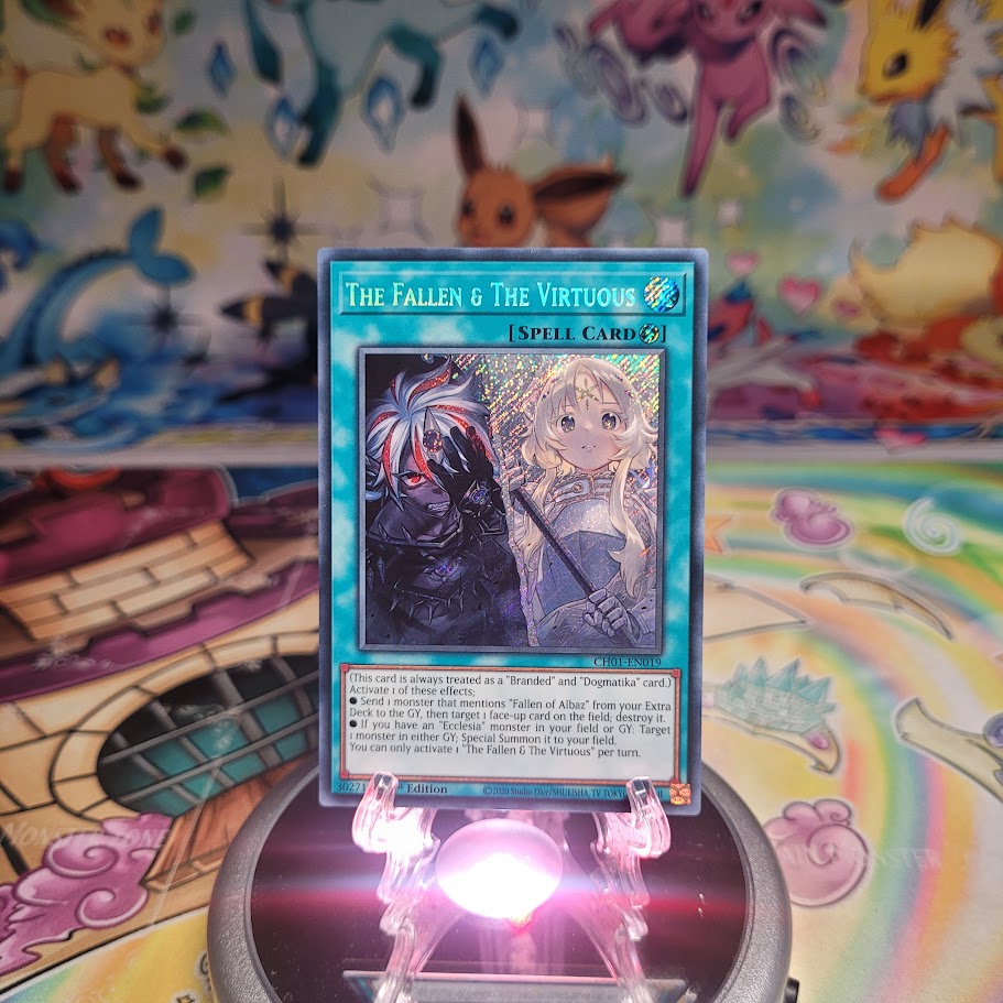 A Secret Rare "The Fallen & The Virtuous" card from the Yugioh Chronicles Structure Deck: The Fallen & the Virtuous (CH01).