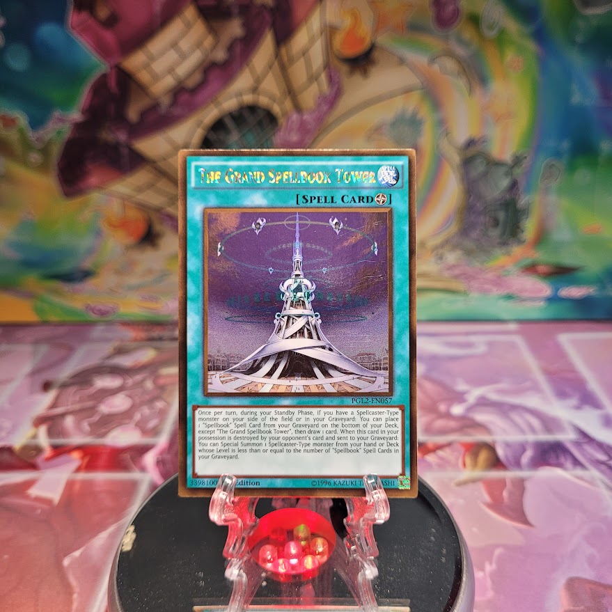 A Gold Rare "The Grand Spellbook Tower" card from the Yugioh Set: Premium Gold: Return of the Bling.