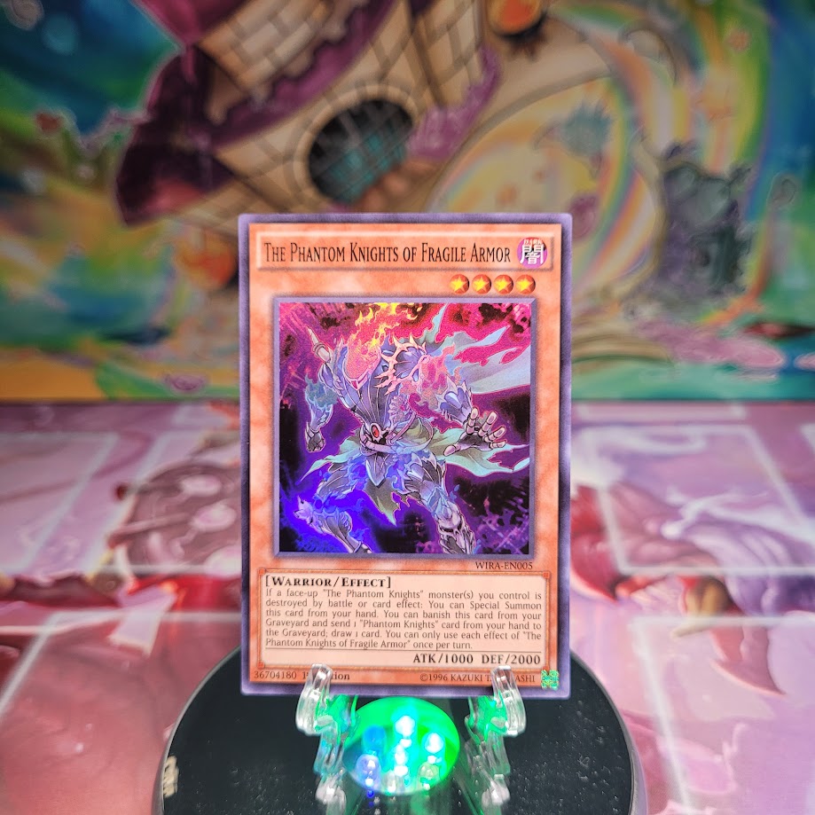 A Super Rare "The Phantom Knights of Fragile Armor" card from the Yugioh Set: Wing Raiders.