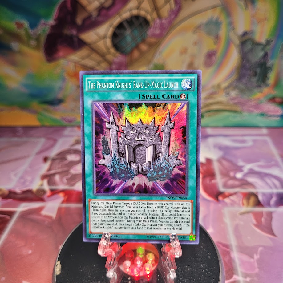 A Super Rare "The Phantom Knights' Rank-Up-Magic Launch" card from the Yugioh Set: Invasion: Vengeance.