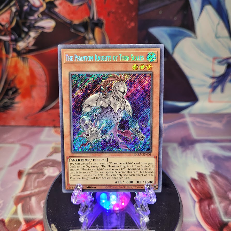 A Secret Rare "The Phantom Knights of Torn Scales" card from the Yugioh Set: Phantom Rage (PHRA).